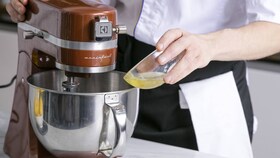 An Electrolux chef adding ingredients to the meringue slowly